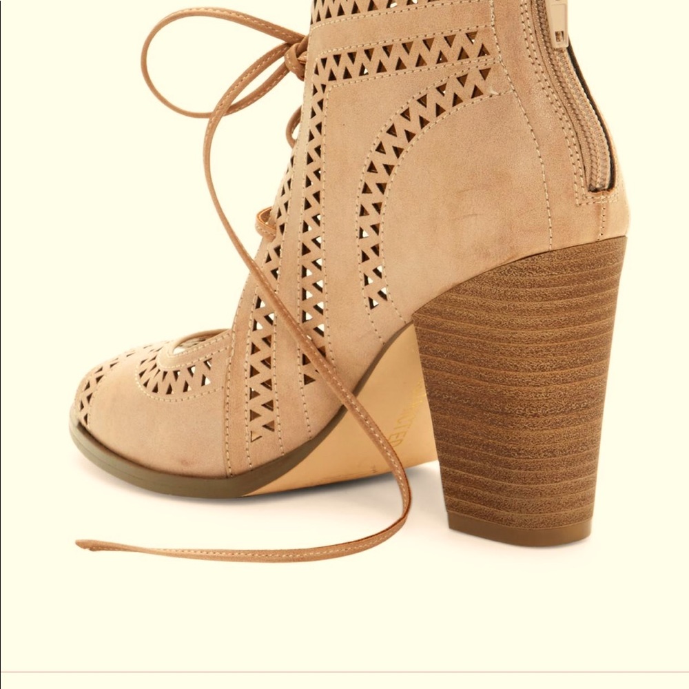 Lace up block heels in tan.